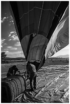 Crew pulling down hot air ballon, Tahoe National Forest. California, USA ( black and white)