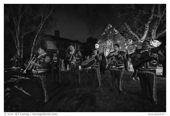 Mariachi musicians in front of decorated house. Petaluma, California, USA (black and white)
