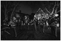 Mariachi musicians in front of decorated house. Petaluma, California, USA ( black and white)