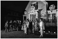 Family and guests pose in Halloween costumes. Petaluma, California, USA ( black and white)