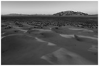 Aerial view of Cadiz dunes and mountain at sunset. Mojave Trails National Monument, California, USA ( black and white)