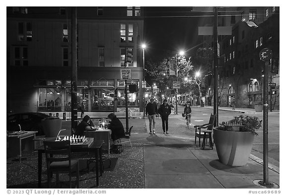 Telegraph Avenue at night with chessboards. Berkeley, California, USA (black and white)