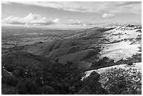 Aerial view of hills with snow overlooking Evergreen Valley. San Jose, California, USA ( black and white)