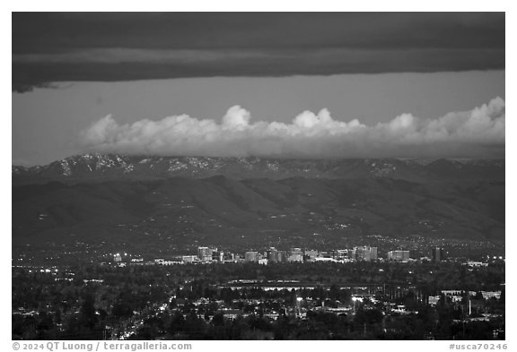Apple headquarters, San Jose skyline, and snowy Mt Hamilton Range at dusk. San Jose, California, USA (black and white)
