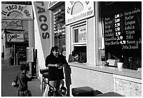 Hispanic women at a taco shop. Redwood City,  California, USA (black and white)