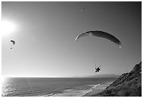 Paragliders soaring above the Ocean, the Dumps, Pacifica. San Mateo County, California, USA (black and white)