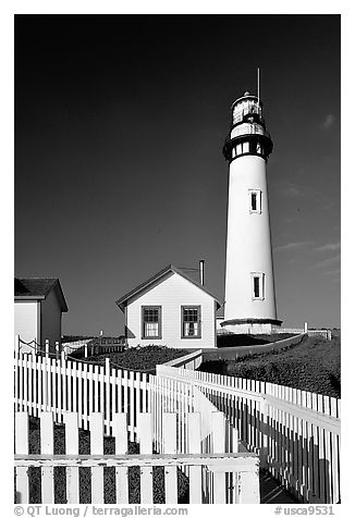 Fence and Pigeon Point Lighthouse, afternoon. San Mateo County, California, USA (black and white)