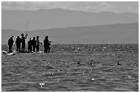 Fishermen on the shore of Salton Sea. California, USA (black and white)
