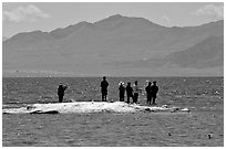 Fishermen on the shore of Salton Sea. California, USA (black and white)