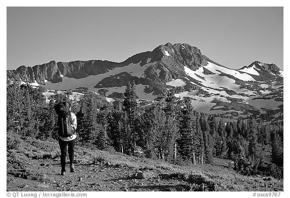 Backpacker  on trail towards Round Top. Mokelumne Wilderness, Eldorado National Forest, California, USA (black and white)