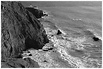 Cliffs, waves,  and Point Bonita Lighthouse, late afternoon. California, USA (black and white)