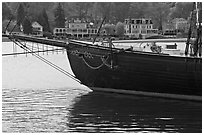 LA Dunton schooner and houses across the Mystic River. Mystic, Connecticut, USA (black and white)