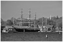 Three masted ship, Mystic River, and church. Mystic, Connecticut, USA (black and white)
