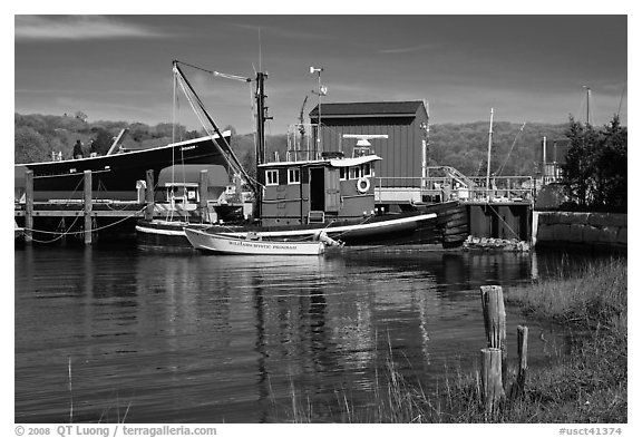 Boats and reflections at shipyard. Mystic, Connecticut, USA (black and white)