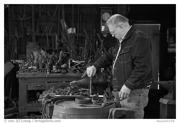 Man in ironwork shop. Mystic, Connecticut, USA (black and white)