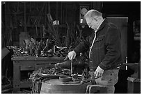 Man in ironwork shop. Mystic, Connecticut, USA (black and white)