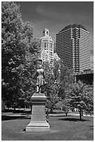 Statue in park and high-rise buildings. Hartford, Connecticut, USA (black and white)