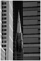 Church spire and modern buildings. Chicago, Illinois, USA (black and white)