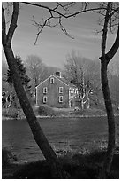 Historic house next to pond, Sandwich. Cape Cod, Massachussets, USA (black and white)