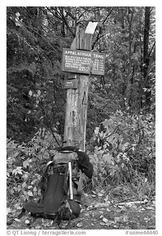 Backpack and marker for last 100 miles, wildest of Appalachian trail. Maine, USA (black and white)