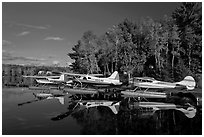 Floatplanes and reflections in Moosehead Lake  late afternoon, Greenville. Maine, USA ( black and white)