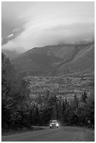 Truck on road below cloud-capped Katahdin. Maine, USA (black and white)