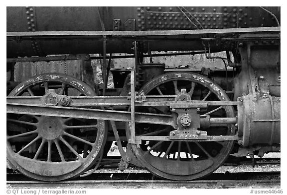 Wheels and pistons of vintage locomotive. Allagash Wilderness Waterway, Maine, USA (black and white)