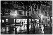 Street with wet pavement at night. Bar Harbor, Maine, USA ( black and white)