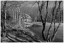 Lake, forest, and house in late winter. Maine, USA ( black and white)
