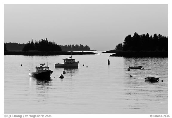 Boats and Penobscot Bay islets, sunrise. Stonington, Maine, USA (black and white)