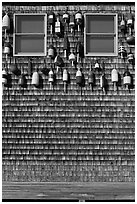 Facade decorated with buoys. Maine, USA ( black and white)