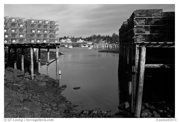Lobster traps framing harbor. Corea, Maine, USA (black and white)