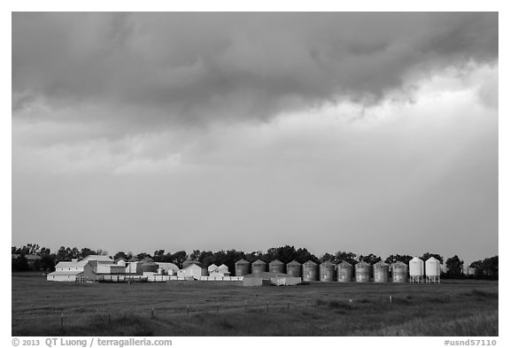 Storm clouds over grain silos. North Dakota, USA (black and white)