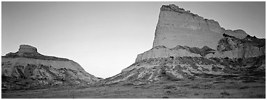 Cliffs glowing red at dawn,  Scotts Bluff National Monument. Nebraska, USA (Panoramic black and white)
