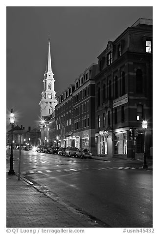 White-steepled Church and street with brick buildings by night. Portsmouth, New Hampshire, USA (black and white)