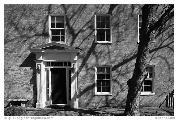 Brick house with tree shadows. Portsmouth, New Hampshire, USA (black and white)