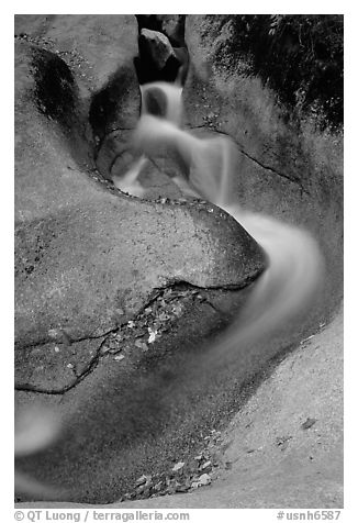 Water flowing over smooth granite, Franconia Notch State Park. New Hampshire, USA (black and white)