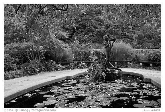 Pool and sculpture inspired by children South Garden. NYC, New York, USA (black and white)