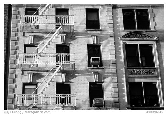 Residential building with emergency exit staircases. NYC, New York, USA (black and white)