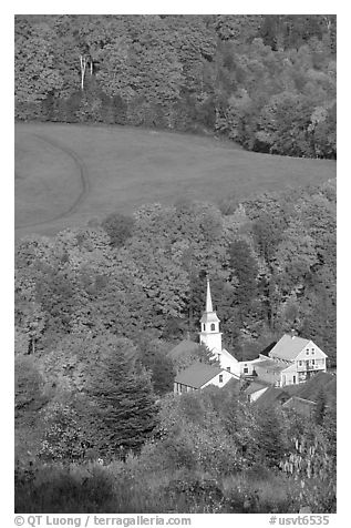 Church of East Corinth among trees in fall color. Vermont, New England, USA (black and white)