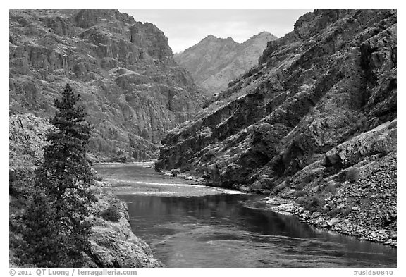 High cliffs above free-flowing part of Snake River. Hells Canyon National Recreation Area, Idaho and Oregon, USA (black and white)