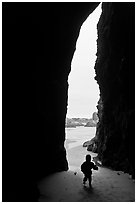 Infant and sea cave opening from inside. Bandon, Oregon, USA ( black and white)