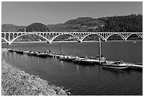 Boat deck and Isaac Lee Patterson Bridge over the Rogue River. Oregon, USA (black and white)