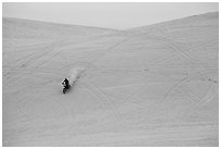 Motorcyle down dune, Oregon Dunes National Recreation Area. Oregon, USA ( black and white)