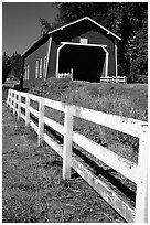 Fence and red covered bridge, Willamette Valley. Oregon, USA (black and white)