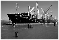 Cargo ship loading floated timber. Oregon, USA (black and white)