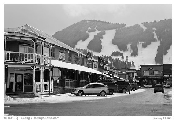 Town square stores and ski slopes in winter. Jackson, Wyoming, USA (black and white)