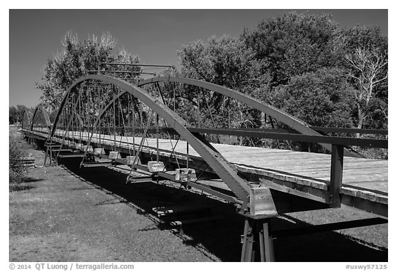 Three-span bowstring through truss bridge over the North Platte River. Fort Laramie National Historical Site, Wyoming, USA (black and white)