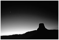 Profile of volcanic monolith at dusk,  Devils Tower National Monument. Wyoming, USA (black and white)