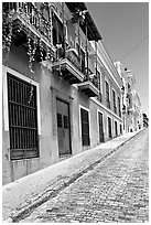 Old cobblestone street and pastel-colored houses, old town. San Juan, Puerto Rico (black and white)